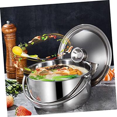 Cook with big cooking pot in the kitchen stock photo