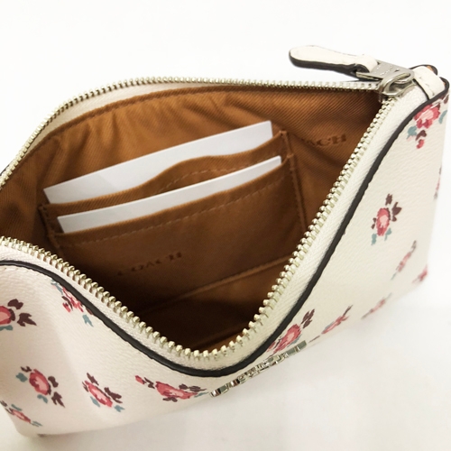 COACH 專櫃款立體馬車LOGO PVC防刮皮革大款手拿包(米白花卉)