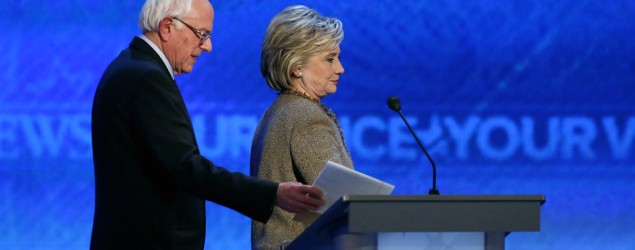Bernie Sanders and Hillary Clinton during the Democratic presidential primary debate on Dec. 19. (Jim Cole/AP)
