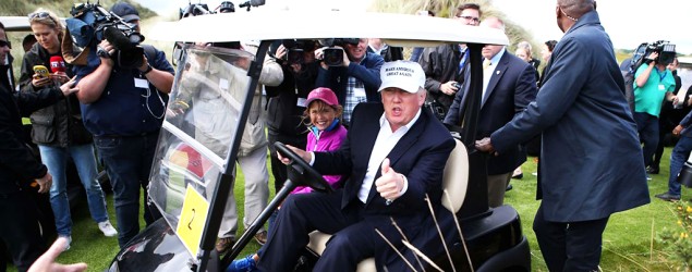 Donald Trump chats with the media at his golf course in Scotland. (AP)