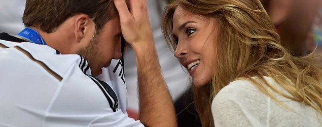 Mario Goetze congratulated by his girlfriend, Ann-Kathrin Brömmel. (AP)