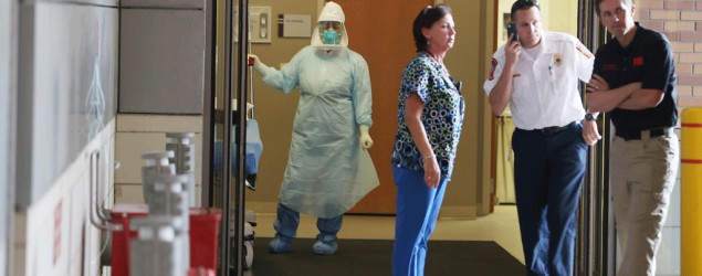 Health care workers at the Texas Health Presbyterian Hospital, in Dallas, on Oct. 8 (Joe Raedle/AFP)