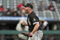 Chicago White Sox relief pitcher Liam Hendriks celebrates after the White Sox clinched the American League Central title by defeating the Cleveland Indians in the first baseball game of a doubleheader, Thursday, Sept. 23, 2021, in Cleveland. (AP Photo/Tony Dejak)