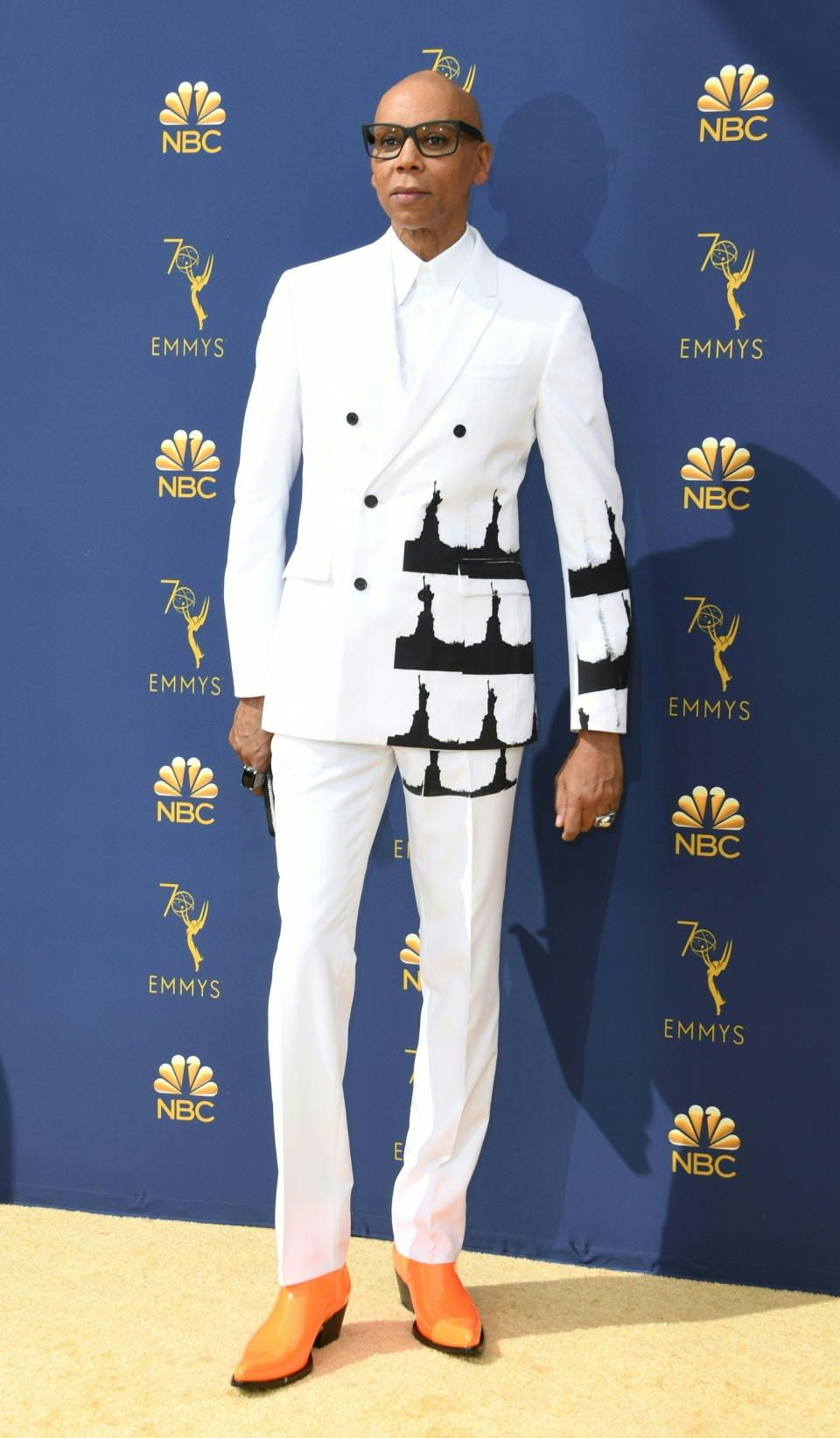 <p>The <em>RuPaul’s Drag Race</em> host had a pop of print on his all-white suit. (Photo: Getty Images) </p>