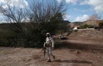 A soldier patrols the Mormon community in La Mora