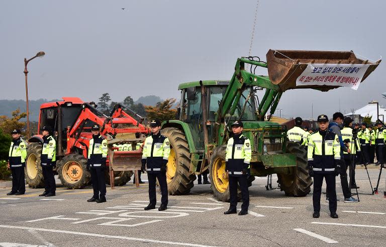 Local residents set tractors at the entrance of Imjingak peace park to block South Korean activists launching propaganda leaflets into North Korea from the border city of Paju, on October 25, 2014