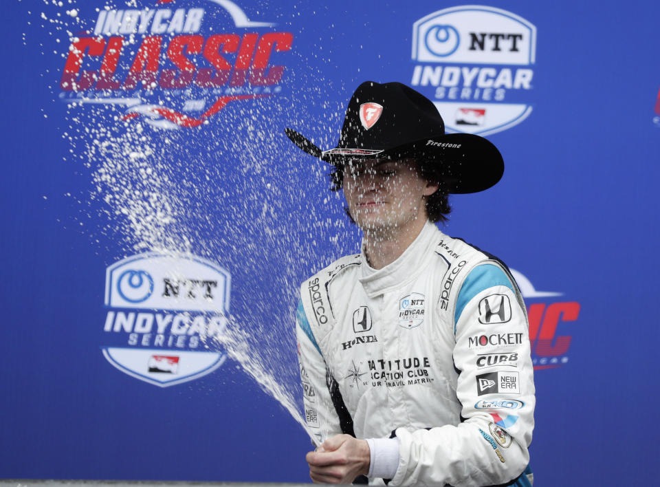 Colton Herta celebrates his win in the IndyCar Classic auto race, Sunday, March 24, 2019, in Austin, Texas. (AP Photo/Eric Gay)