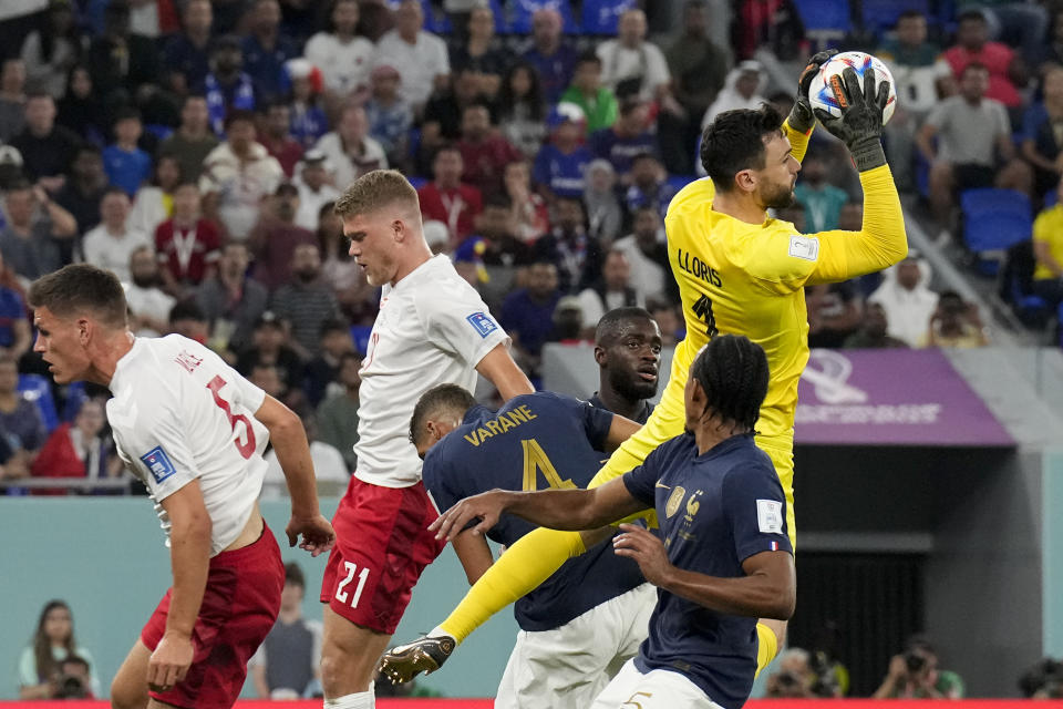 France's goalkeeper Hugo Lloris blocks a shot during a World Cup group D soccer match against Denmark at the Stadium 974 in Doha, Qatar, Saturday, Nov. 26, 2022. (AP Photo/Martin Meissner)