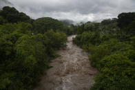 The swollen Los Esclavos River flows violently during tropical storm Amanda in Cuilapa, eastern Guatemala, Sunday, May 31, 2020. The first tropical storm of the Eastern Pacific season drenched parts of Central America on Sunday and officials in El Salvador said at least seven people had died in the flooding. (AP Photo/Moises Castillo)