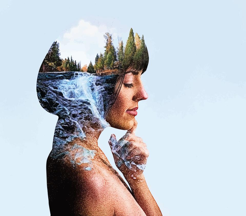 multiple exposure of young woman morphing into river and waterfall