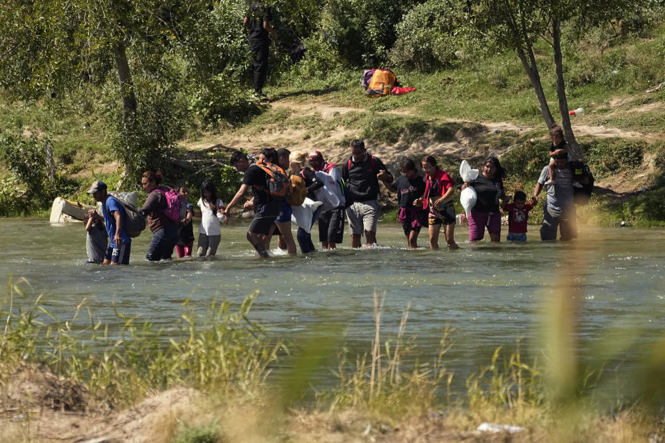 Migrants cross the Rio Grande from Mexico into the U.S. on Thursday, Sept. 21, 2023, in Eagle Pass, Texas. / Credit: Eric Gay / AP