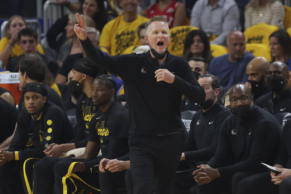 Golden State Warriors head coach Steve Kerr gestures toward players during the first half of his team's Game 1 of the NBA basketball playoffs Western Conference finals against the Dallas Mavericks in San Francisco, Wednesday, May 18, 2022. (AP Photo/Jed Jacobsohn)