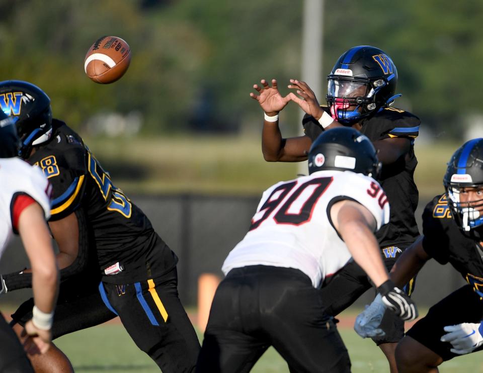 Wi-Hi's Takai Hugee (1) gets the snap in the game against Linganore Friday, Sept. 1, 2023, in Salisbury, Maryland. Linganore defeated WiHi 40-0 to start the season.