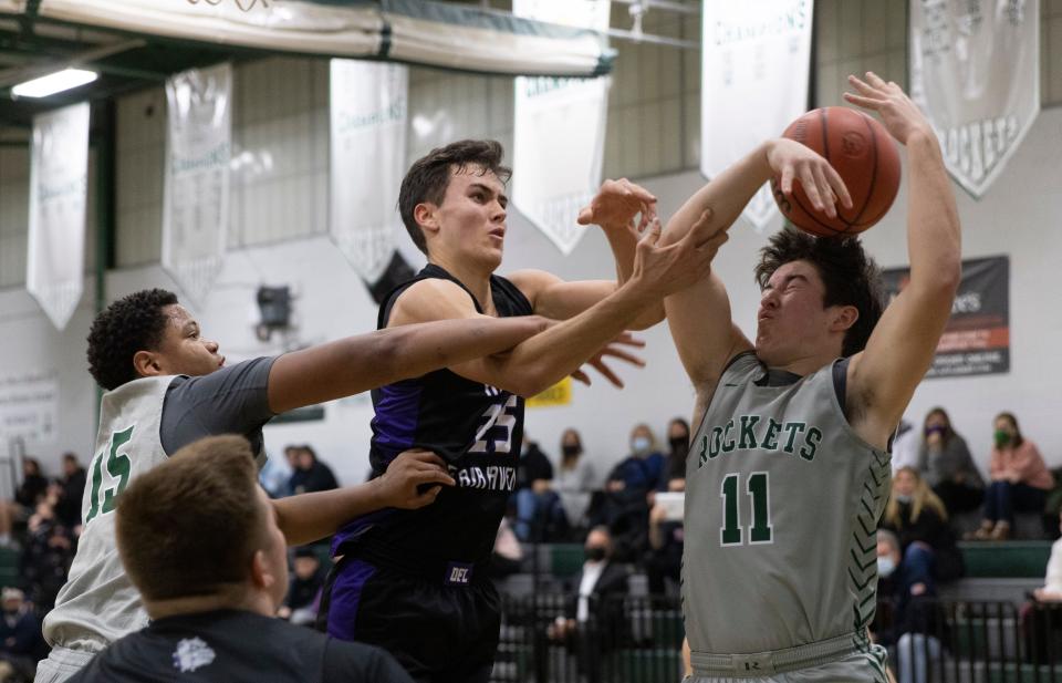 Raritan Tyzaya Smith and William Tigar battle with Scott Gyimesi for a second half rebound. Rumson-Fair Haven Boys Basketball defeats Raritan in Hazlet, NJ on January 20, 2022. 