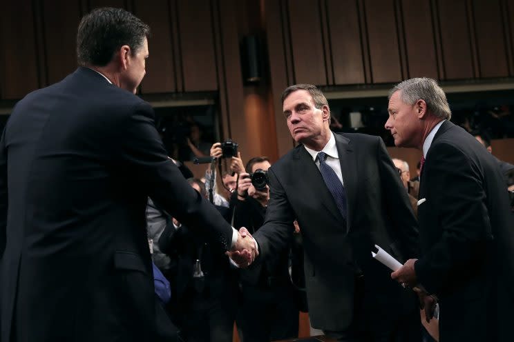 Former FBI Director James Comey (L) is greeted by Senate Intelligence Committee Chairman Richard Burr (R-NC) (R) and ranking member Sen. Mark Warner (D-VA) before a hearing in the Hart Senate Office Building on Capitol Hill June 8, 2017 in Washington. (Photo: Drew Angerer/Getty Images)