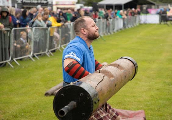 Strong men prove themselves in the onsite Highland games (Mark Gibson)