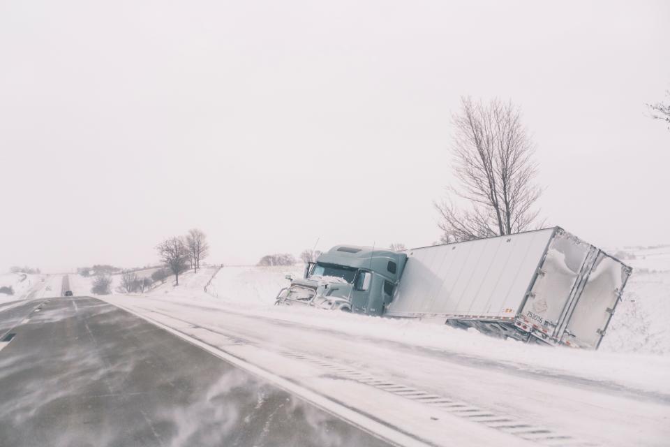 An crashed semi truck sits abandoned along Interstate 80 in central Iowa on Saturday, Jan. 13, 2024. Heavy snow and high winds led the National weather service to issue a blizzard warning for much of the state of Iowa.