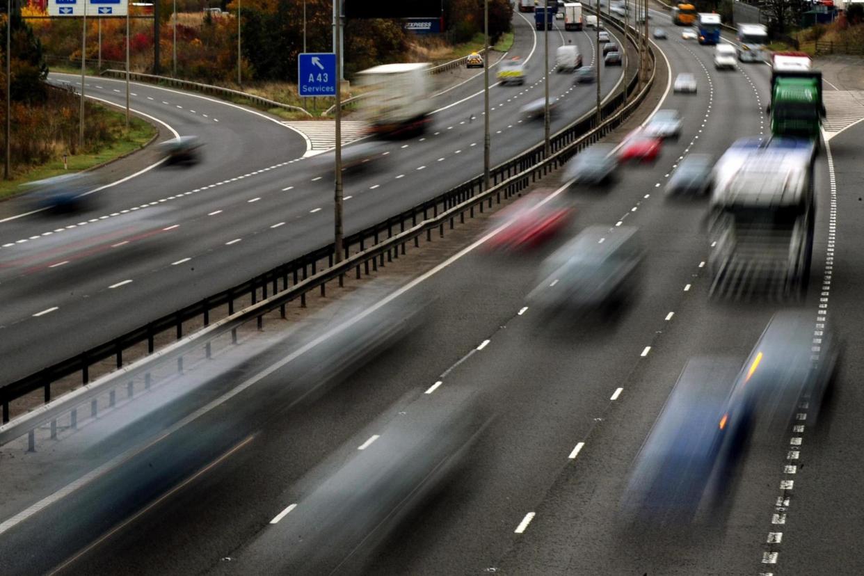 Dangerous: The teens were found 'hanging off' the wrong side of the rails on motorway bridges: PA Wire/PA Images