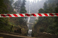 <p>A caution tape warns visitors to Multnomah Falls east of Troutdale, Ore., on Sept. 6, 2017 after the Eagle Creek (Photo: Chris Pietsch/The Register-Guard via AP) </p>