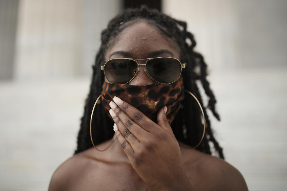 Aalayah Eastmond, a Parkland, Fla. activist, poses for a portrait wearing a cloth face mask after leading the crowd in chants at the Lincoln Memorial in Washington on Wednesday, June 10, 2020, during protests over the death of George Floyd, a Black man who died after being restrained by Minneapolis police officers on May 25. (AP Photo/Maya Alleruzzo)