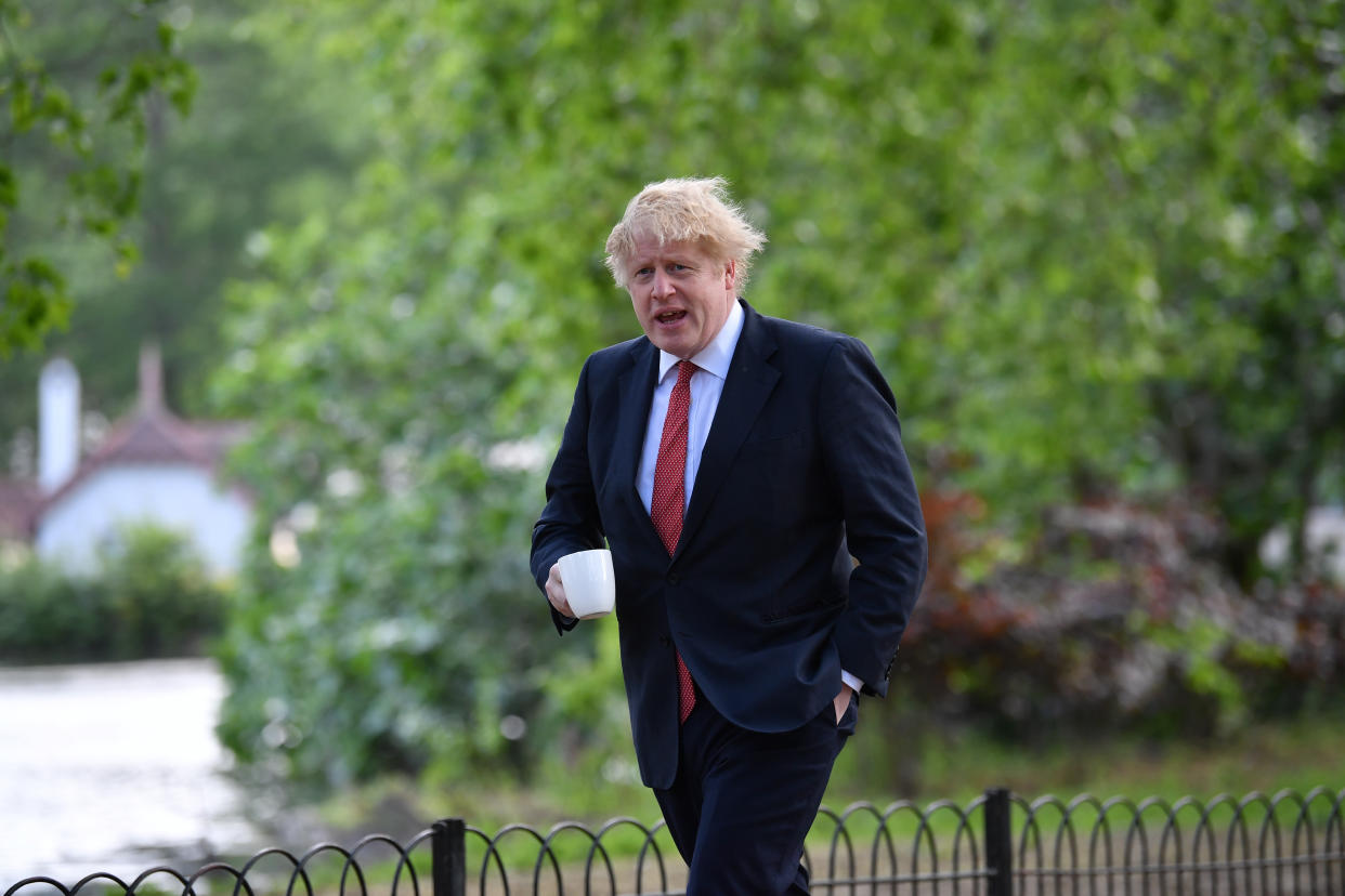 Prime Minister Boris Johnson takes a morning walk in St James's Park in London.