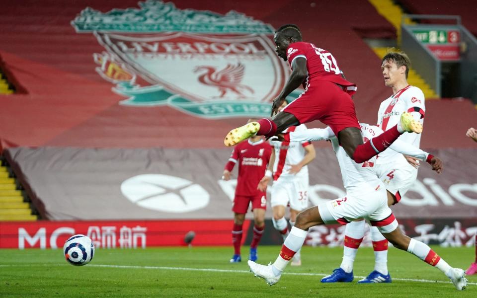 Mane leaps high to head in the opener on a nervy night for Liverpool  - PA