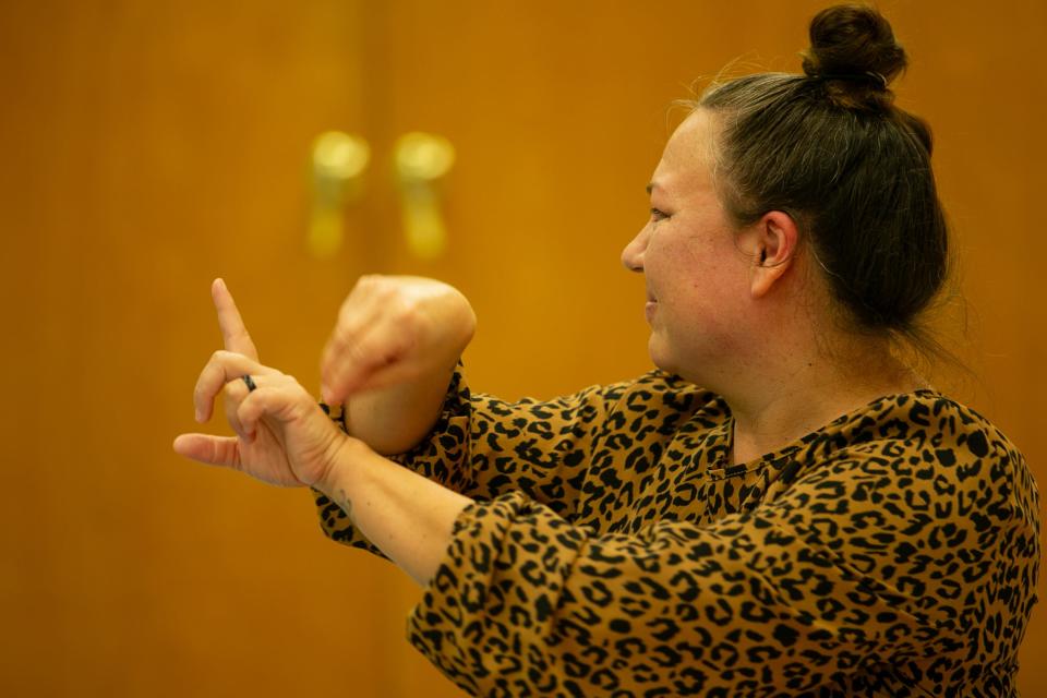 LeAnn Salinas, event coordinator, signs the word "banana" to participants in the Deaf and Hard of Hearing Center's ASL for Babies class Tuesday, Oct. 3, 2023.