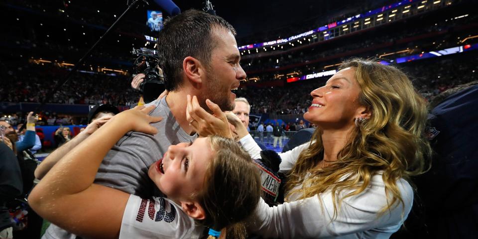 Tom Brady #12 of the New England Patriots celebrates with his wife Gisele Bündchen after the Super Bowl LIII against the Los Angeles Rams at Mercedes-Benz Stadium on February 3, 2019 in Atlanta, Georgia.