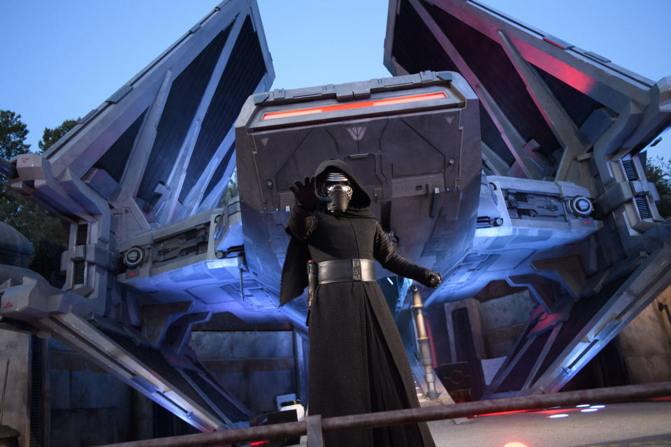 Kylo Ren, one of several characters featured at Star Wars: Galaxy's Edge, flexes his powers outside a new First Order ship, the TIE Echelon. (Photo: Richard Harbaugh/Disney Parks)