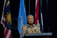 Malaysia's interim leader Mahathir Mohamad pauses during a speech at the committee on the exercise of the inalienable rights of the Palestinian people, in Kuala Lumpur, Malaysia, Friday, Feb. 28, 2020. The speaker of Malaysia's House rejected Mahathir Mohamad's call for a vote next week to chose a new premier, deepening the country's political turmoil after the ruling alliance collapsed this week. (AP Photo/Vincent Thian)