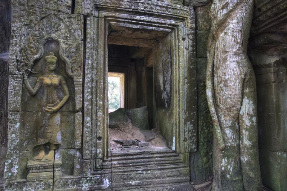 A niche with elaborate carvings in the Ta Prohm temple, one of the most visited sites of the Angkor Archaeological Park.