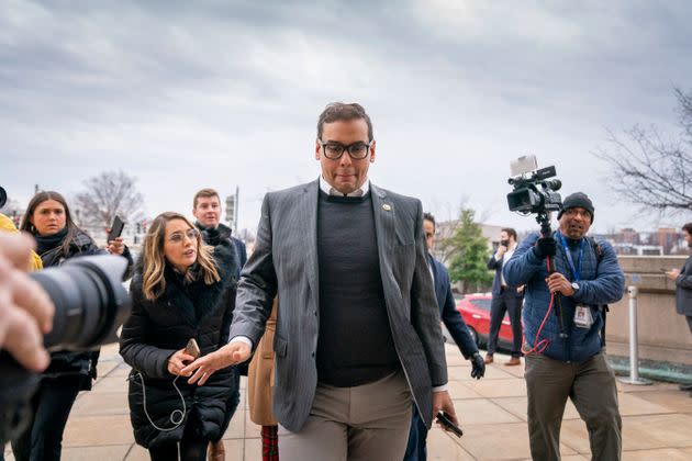 Rep. George Santos (R-N.Y.) leaves a House Republican conference meeting Wednesday on Capitol Hill.