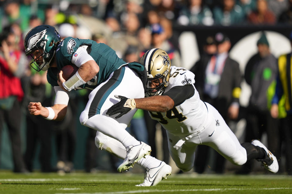 Philadelphia Eagles quarterback Gardner Minshew is tackled by New Orleans Saints defensive end Cameron Jordan (94) in the first half of an NFL football game in Philadelphia, Sunday, Jan. 1, 2023. (AP Photo/Matt Slocum)