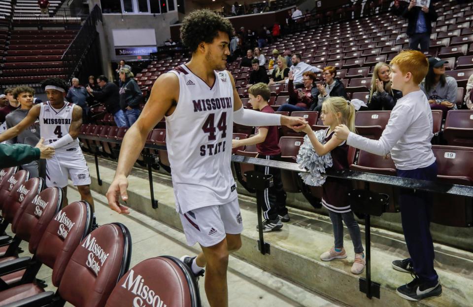 Gaige Prim, of Missouri State, fist bumps some young fans following the Bears 81-76 win over Southern Illinois at JQH Arena on Wednesday, Jan. 12, 2022.