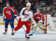 <p>WORST: There's not much about the 2009 NHL All-Star Game jerseys that we like. In this photo, Keith Tkachuk of the Western Conference All-Stars waits for a pass as Mike Komisarek of the Eastern Conference defends the crease in front of goaltender Tim Thomas at the Bell Centre in Montreal. (Getty Images) </p>