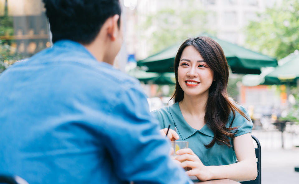 Young Asian couple dating at coffee shop