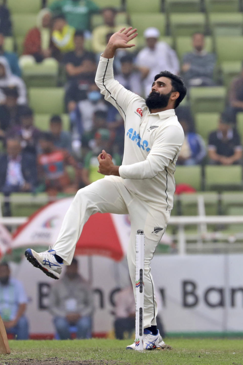 New Zealand's Ajaz Patel bowls during the fourth day of the second test cricket match between Bangladesh and New Zealand in Dhaka, Bangladesh, Saturday, Dec. 9, 2023. (AP Photo/Mosaraf Hossain)