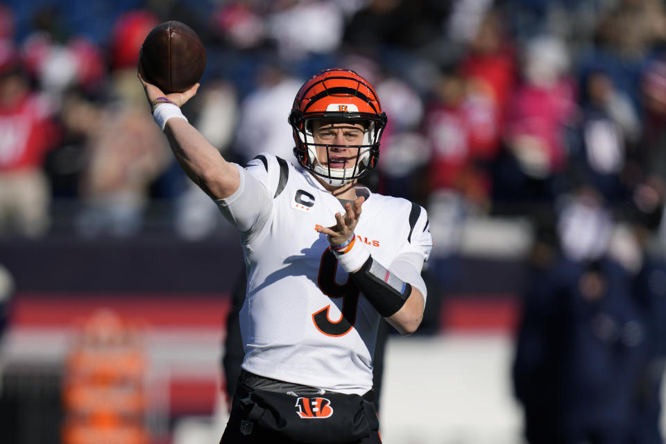 Cincinnati Bengals quarterback Joe Burrow winds up to pass while warming up prior to an NFL football game between the Bengals and the New England Patriots, Saturday, Dec. 24, 2022, in Foxborough, Mass. (AP Photo/Charles Krupa)