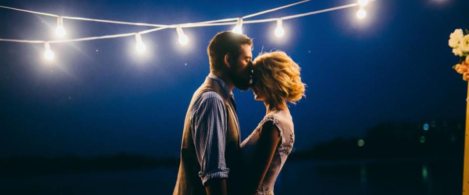 wedding couple near the river at night