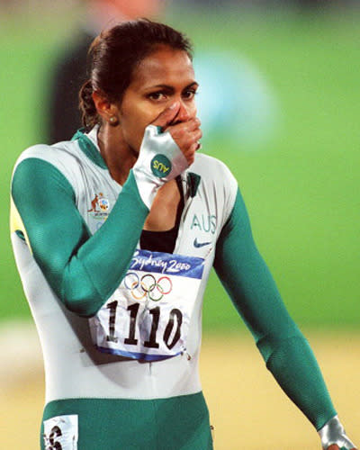 <p>Freeman covers her mouth in disbelief after winning gold.</p>