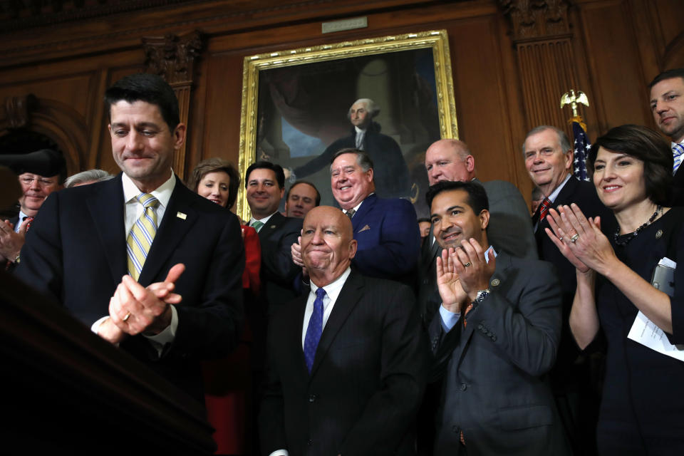 House Speaker Paul Ryan of Wis., left, leads applause for House Ways and Means Chair Rep. Kevin Brady, R-Texas, along with Rep. Carlos Curbelo, R-Fla., and Rep. Cathy McMorris Rodgers, R-Wash., during a news conference following a vote on tax reform on Capitol Hill in Washington, Thursday, Nov. 16, 2017. (AP Photo/Jacquelyn Martin)