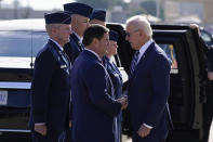 President Joe Biden greets Arizona Gov. Doug Ducey after arriving on Air Force One, Tuesday, Dec. 6, 2022, at Luke Air Force Base in Maricopa County, Ariz. (AP Photo/Patrick Semansky)