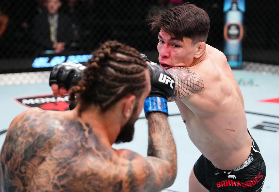 LAS VEGAS, NEVADA – APRIL 06: (R-L) Ignacio Bahamondes of Chile punches Christos Giagos in a lightweight fight during the UFC Fight Night event at UFC APEX on April 06, 2024 in Las Vegas, Nevada. (Photo by Jeff Bottari/Zuffa LLC via Getty Images)