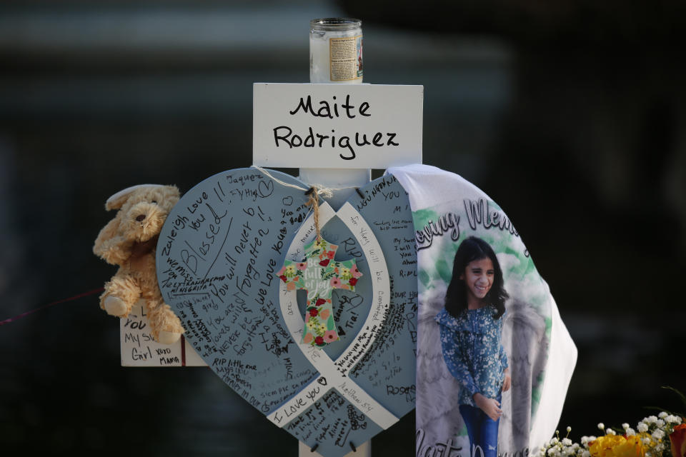Maite Rodriguez's cross stands at a memorial site for the victims killed in this week's shooting at Robb Elementary School in Uvalde, Texas, Friday, May 27, 2022. (AP Photo/Dario Lopez-Mills)