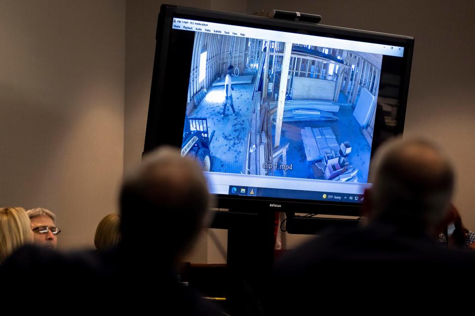 Prosecutor Linda Dunikoski shows a video of Ahmaud Arbery entering a house under construction during the trial of Greg McMichael and his son, Travis McMichael, and a neighbor, William "Roddie" Bryan in the Glynn County Courthouse, Tuesday, Nov. 9, 2021, in Brunswick, Ga.