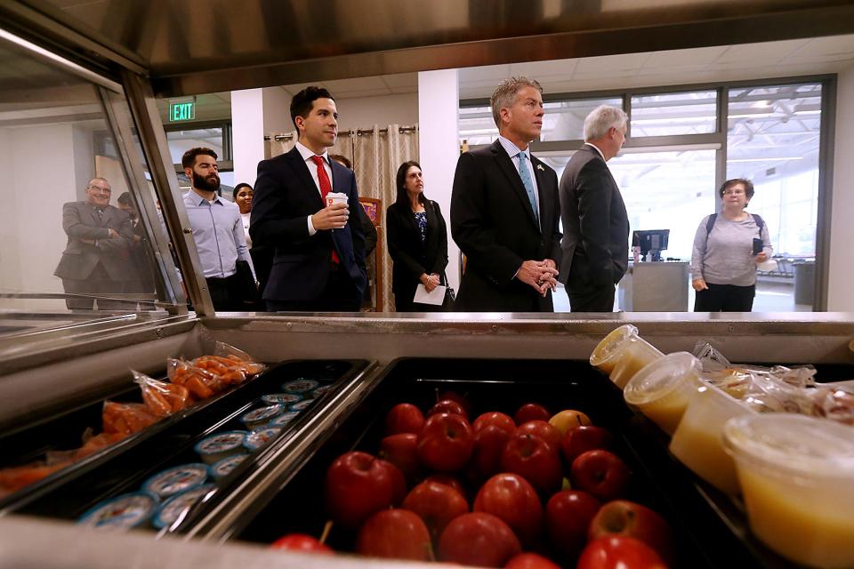 Fresh fruit sit in their containers while Rep. Andy Vargas and Sen. Walter Timilty listen to Sarah Coughlin, school nutrition officer at Braintree schools, during a tour of East Middle School's cafeteria in Braintree on Thursday. About 3,500 students, or 66% of the district, are enjoying free lunches in the Braintree school system.
(Photo: Robin Chan/ Wicked Local Staff Photo)
Caption Override