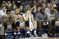 FILE - In this March 22, 2013, file photo, Georgetown players and personnel react on the bench in the final minutes of a second-round game against Florida Gulf Coast in the NCAA college basketball tournament in Philadelphia. Florida Gulf Coast won 78-68. The high-flying FGSU Eagles and their showstopping offense earned their place in NCAA Tournament lore when, as a No. 15 seed in the South Region, they upset Georgetown and San Diego State in Philadelphia to reach the 2013 Sweet 16. (AP Photo/Michael Perez, File)