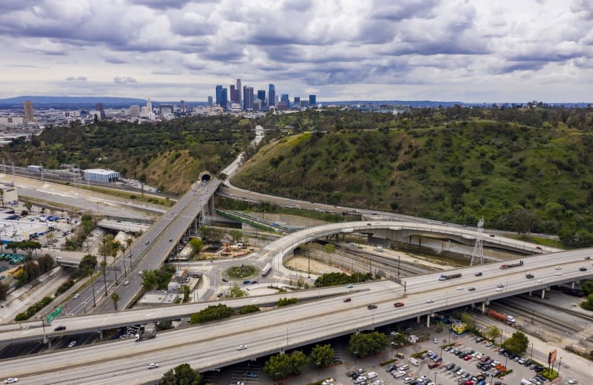 LOS ANGELES, CALIF. -- FRIDAY, MARCH 20, 2020: Usually clogged with traffic, vehicles flow smoothly along Interstate 5 and the 110 Freeway in Los Angeles, Calif., on March 20, 2020. (Brian van der Brug / Los Angeles Times)