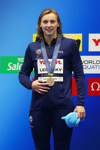 <p> Ian MacNicol/Getty</p> Katie Ledecky sports her newest gold medal at the 2023 World Aquatics Championships.