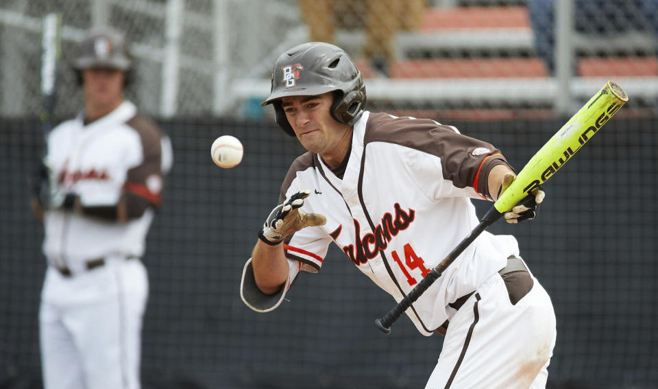 FILE - In this May 10, 2019, file photo, Bowling Green's Neil Lambert bats during the team's NCAA college baseball game against Kent Sate in Bowling Green, Ohio. Bowling Green recently announced that it is dropping baseball. Colleges mulling whether to cut sports amid the coronavirus pandemic must ensure they remain compliant with the federal civil-rights law known as Title IX, which requires the equitable treatment of remaining men's and women's programs. (AP Photo/Rick Osentoski, File)